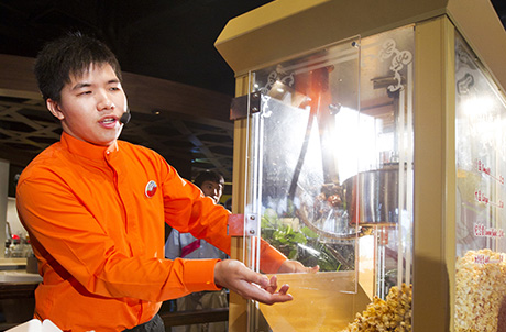 Photo 2: A graduating trainee demonstrates how to prepare popcorns