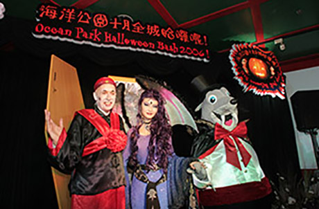 Allan Zeman, Chairman of Ocean Park, appears as a regal Chinese groom, accompanied by the Park's latest Halloween icon Luna Midnyte and Whiskers dressed as a Vampire.